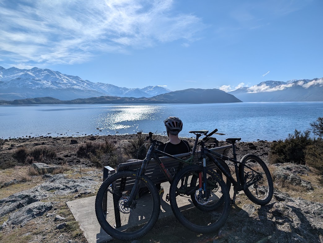 Cyclists exploring Queenstown beside Lake Wakatipu
